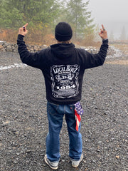 Person wearing a black hoodie with 'Local Boyz' logo, standing outdoors on a foggy day.
